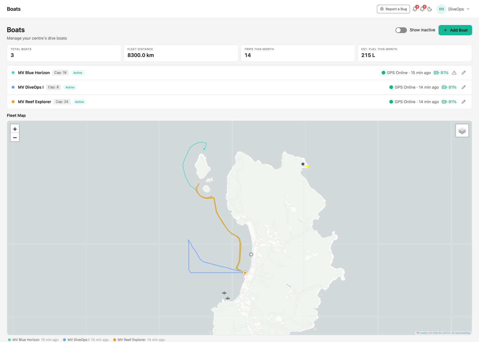 The DiveOps fleet map: dive boats tracked live by GPS around the island, with online status, fuel and service-due indicators.
